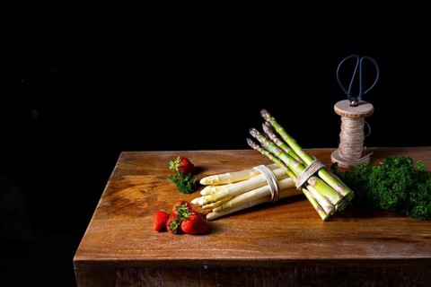 Green and white asparagus on the table