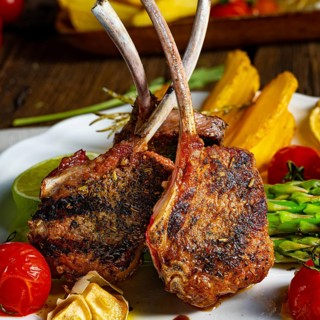Lamb shanks marinated in herbs with green asparagus and lime