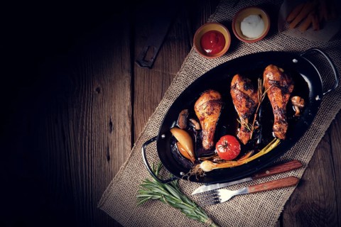 Grilled chicken legs in a barbecue marinade with sweet potatoes