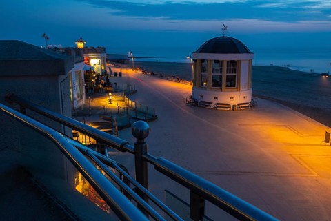 Seaside walk in Borkum town at night with Music Pavilion and lights. Seaside walk in Borkum town at