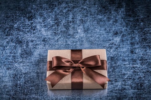 Vintage present box on scratched metallic background holidays concept