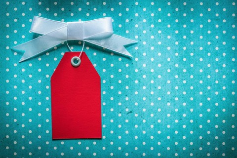 Sale tag on blue polka-dot tablecloth