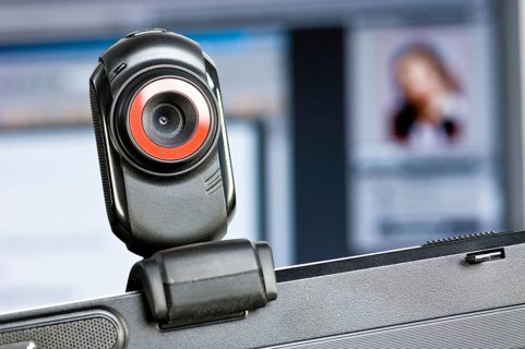 Webcam on monitor, in the background a screen with a portrait of a woman, Federal Republic of