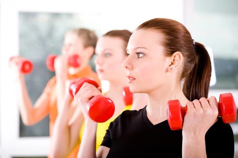 Young women exercising in a step aerobics class