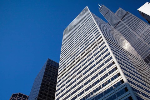 Looking up at business building in downtown, Chicago, USA. A view up through tall skyscrapers to a