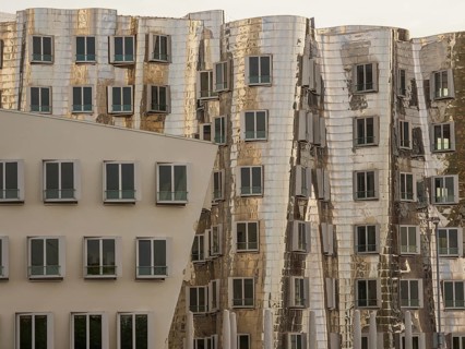 Detailed view of modern, distorted buildings with reflective facades and many windows, düsseldorf,