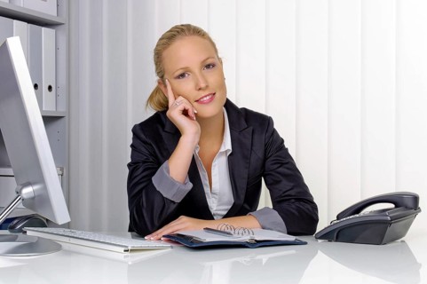 A secretary in the office at her daily work, 35 years, Thoughtful studio shot, Federal Republic of