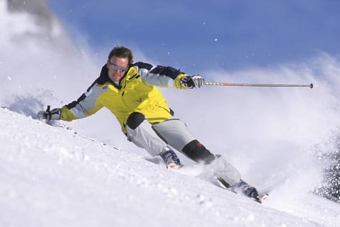 Skiers in action, deep snow, Austria