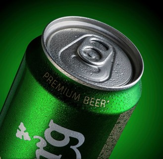 Almaty, Kazakhstan - October 11, 2019: can of beer Carlsberg with drops of water in a green