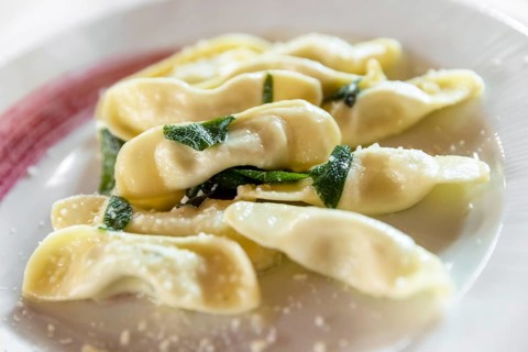 Scarpinocc are typical ravioli from Bergamo, with a characteristic flattened shape. They differ