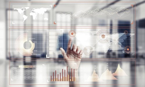Hand of woman working with media interface on screen and office interior at background