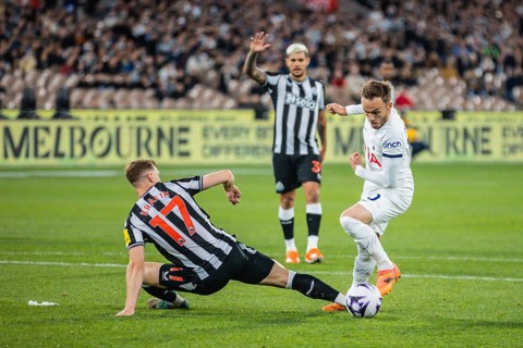 MELBOURNE, AUSTRALIA, MAY 22: James Maddison of Tottenham Hotspur sidesteps Emil Krafth of