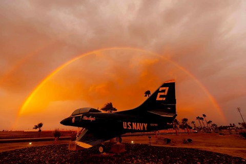 Dawn at Naval Air Field El Centro, CA: Sunlight paints vibrant hues across the sky, casting a