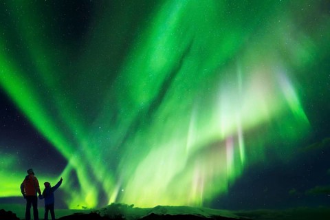 Father and Daughter looking at the Northern Lights