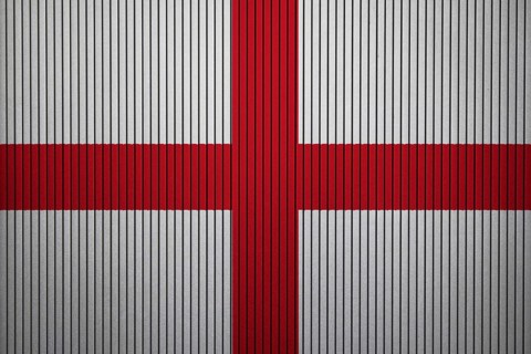 England Flag painted on the cracked grunge concrete wall