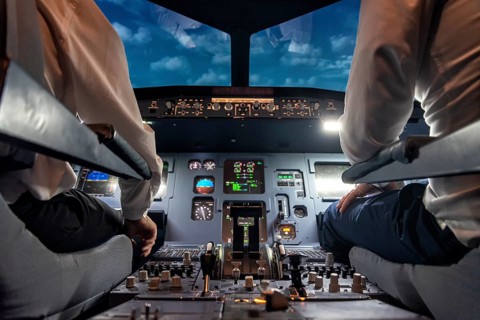 Pilots in the cockpit of an aircraft during a flight