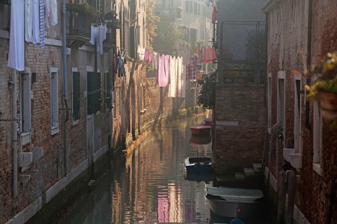 Drying clothes on the rope across venetian channel