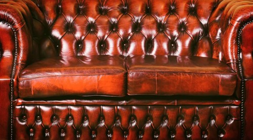 Red Genuine Leather Sofa Near The Wall