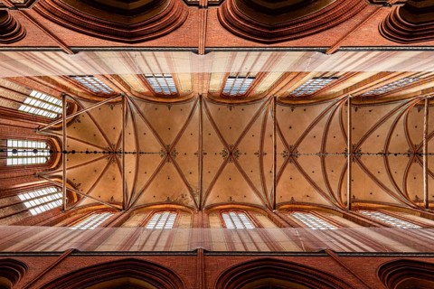 Wismar, Germany, August 2, 2019: Church of St. Nicholas. Interior view directly below the vaults of