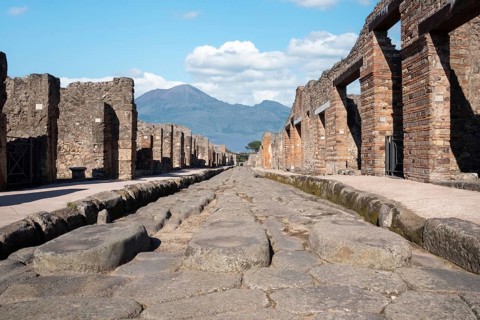 POMPEII, ITALY, MAY 04, 2022, A crosswalk of a typical Roman road in the ancient city of Pompeii,