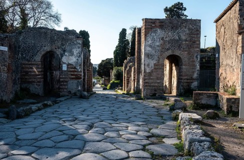 POMPEII, ITALY, MAY 04, 2022, A beautiful typical cobbled street in the ancient city of Pompeii,