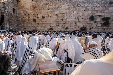 Blessing of the Cohenim in Passover. Jerusalem, Israel. Jews praying at the Western Wall wrapped in