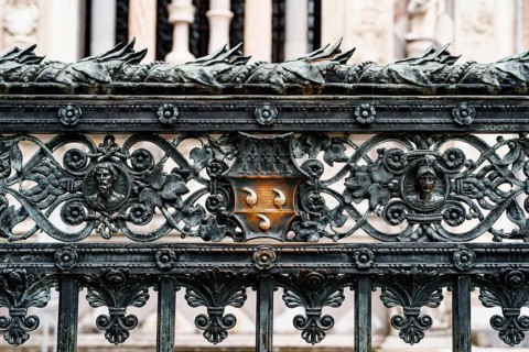 Forged metal fence near the Duomo Cathedral. Milan, Italy.