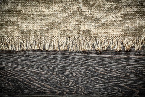 Vintage hessian on wooden board