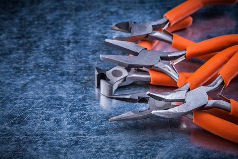 Metal insulated electric pliers nippers horizontal view electricity concept