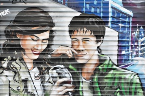 Madrid, Spain, Europe, Colourful mural of a laughing man and a woman drinking wine