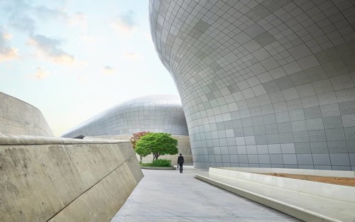 Business people walking among futuristic buildings in modern Seoul city