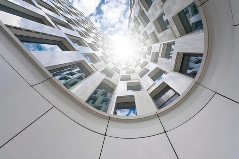 View upwards, along the façade of a high-rise building in Berlin