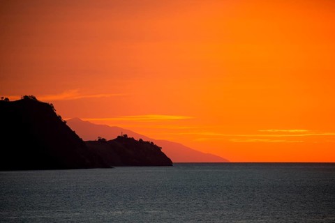 Silhouette of Flores Island at dusk and sunset