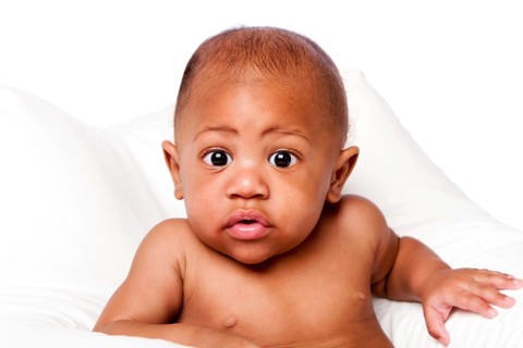 Cute beautiful adorable African baby face with huge eyes on white, Atlanta, USA
