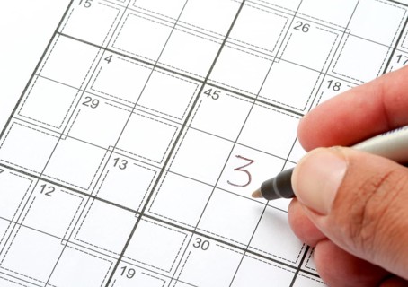 Solving a Crossword Puzzle with human hand writing a number