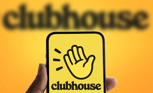 Clubhouse logo is displayed on smartphone. Clubhouse is a social audio app for iOS and Android.