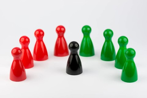 Conceptual game pawns that depict the concept different