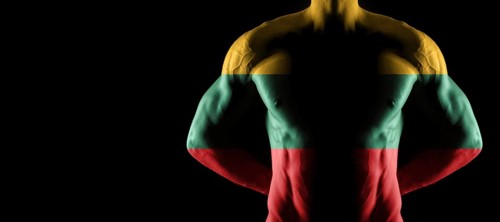 Lithuania flag on muscled male torso with abs, black background