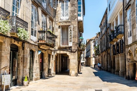 Santiago de Compostela, Spain, July 18, 2020: Old street with arcades in medieval town