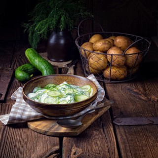 Fresh cucumber salad with yoghurt and young potatoes