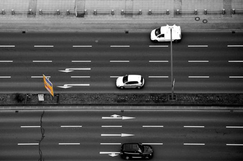 Top view and aerial view of a multi-lane road with road traffic