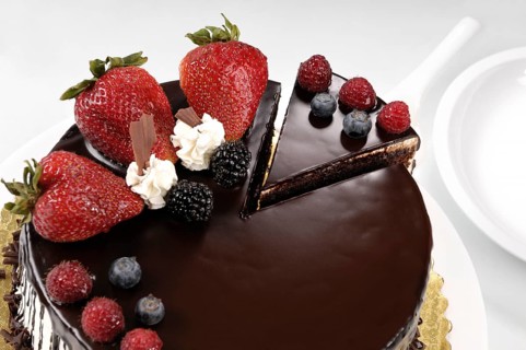 Chocolate cake with strawberries on a table