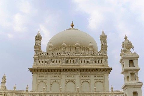Mysore, Karnataka, South India, India, Asia, A detailed dome rises majestically against a cloudy