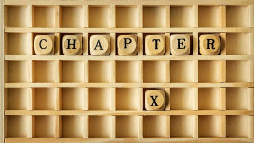 An image of a wooden game with the word chapter ten