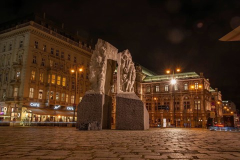 Memorial against war and fascism, monument by Alfred Hrdlicka, behind the opera, night shot,