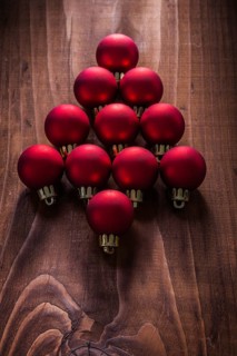 Composition red christmas balls in the form simbold of fir tree