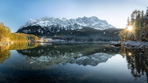 Lake Eibsee Panorama with mountain zugspitze reflection in winter with snow at sunset