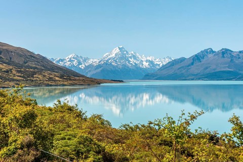 Scenic reflection of Mount Sefton and Mount Cook at lake Pukaki, South Island of New Zealand