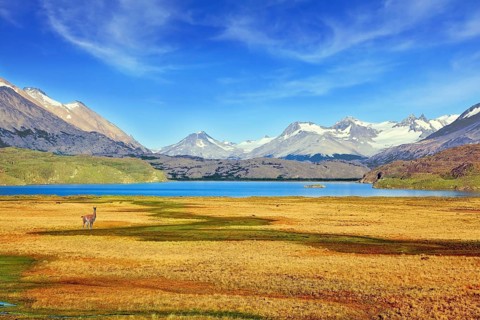 A blue lake in a picturesque valley surrounded by snow-capped mountains. National Park Perito