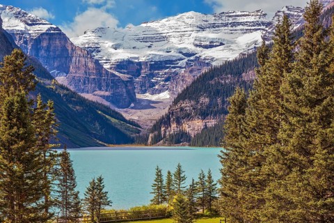 Banff National Park, Rocky Mountains, Canada. Emerald Lake is surrounded by mountains, glaciers and